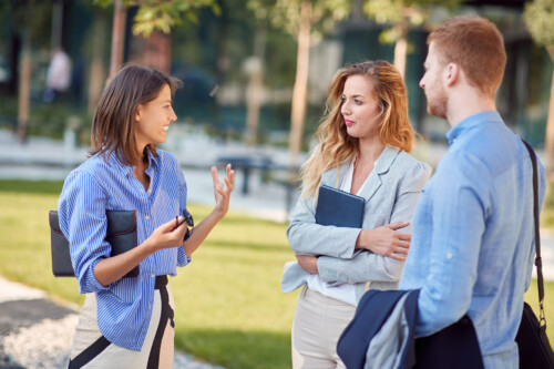 Young, urban and modern colleagues chatting