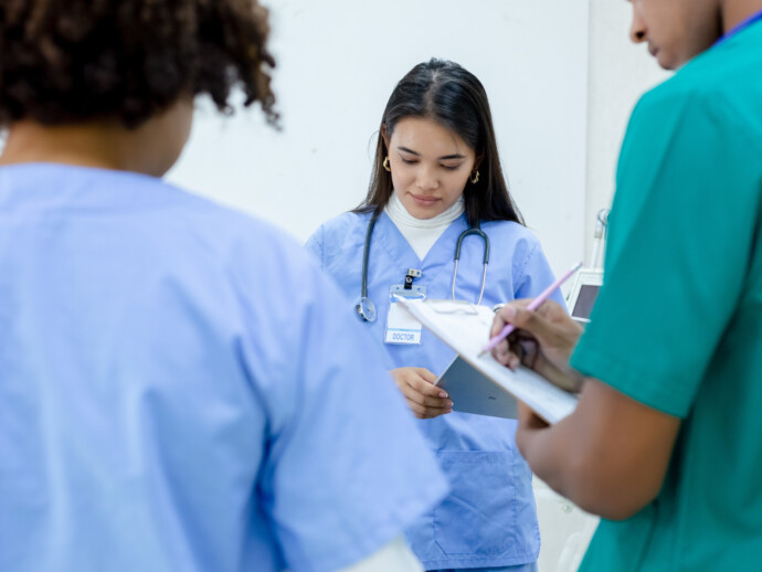 Medical woman student wear blue uniform study in hospital with g