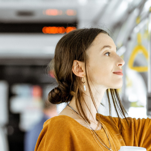 Female passenger using public transport