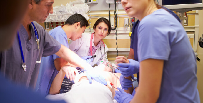 Medical Team Working On Patient In Emergency Room