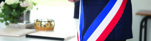 French mayor with a scarf flag during a weeding day