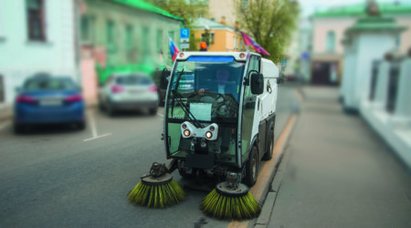 forefront of a machine brush cleaner city. urban service car. Mu