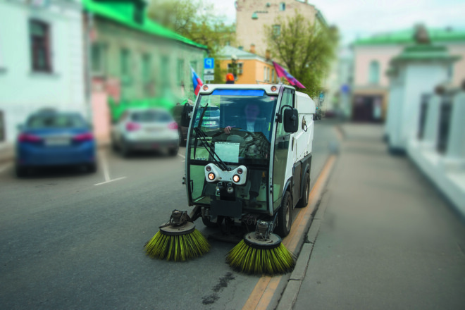 forefront of a machine brush cleaner city. urban service car. Mu