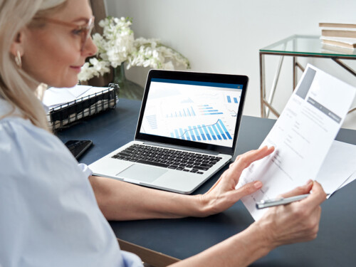 Female hr reading cv during online virtual job interview by video call.