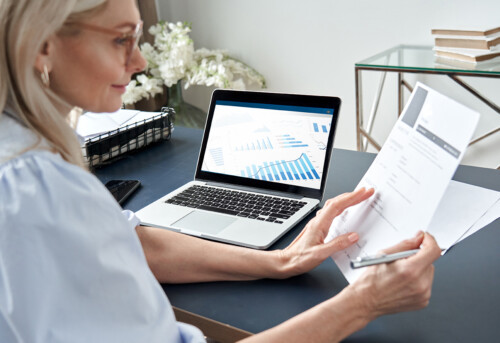 Female hr reading cv during online virtual job interview by video call.