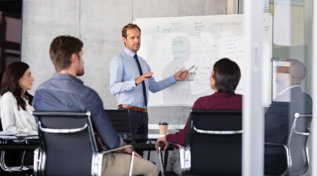 Businessman giving presentation with colleagues