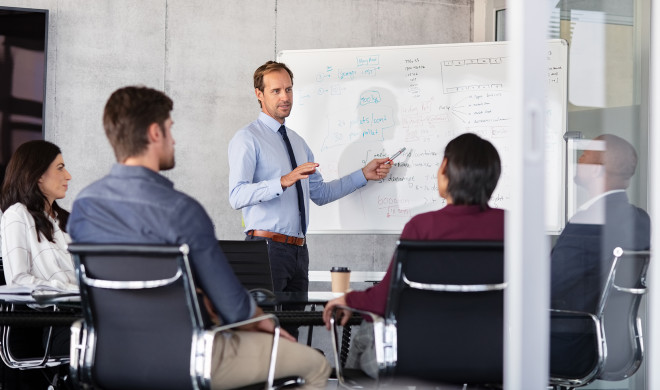 Businessman giving presentation with colleagues