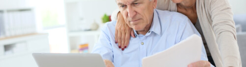 Senior couple doing the income tax declaration online