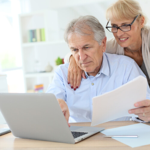 Senior couple doing the income tax declaration online