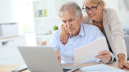 Senior couple doing the income tax declaration online