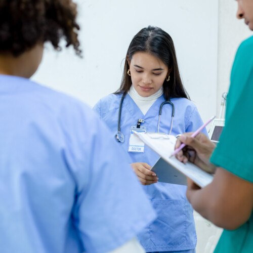 Medical woman student wear blue uniform study in hospital with g