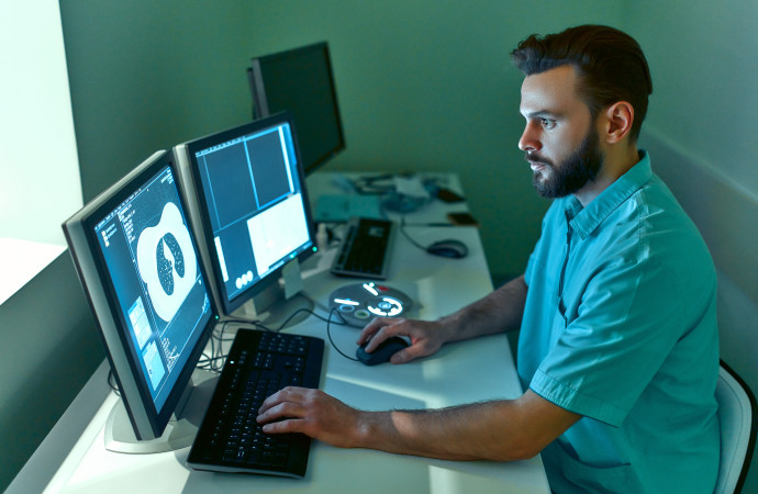 In the medical laboratory, the patient undergoes an MRI or CT sc