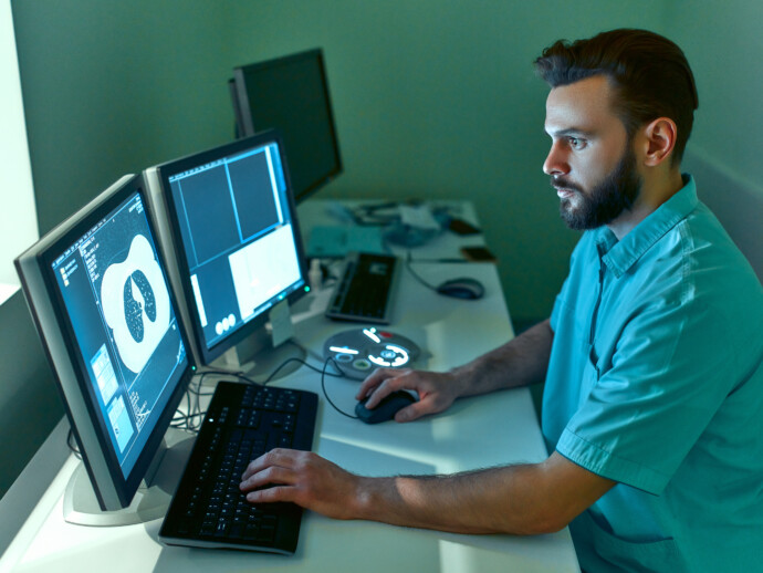 In the medical laboratory, the patient undergoes an MRI or CT sc