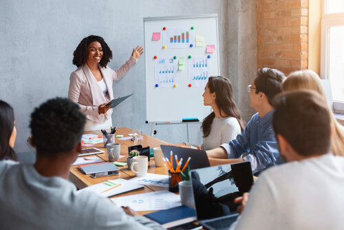 Professional marketologist making presentation during business meeting with colleagues