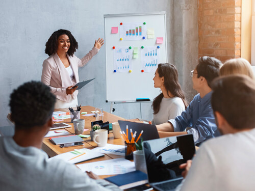 Professional marketologist making presentation during business meeting with colleagues