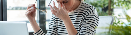 Stressed mature business woman looking worried, tired and overwh