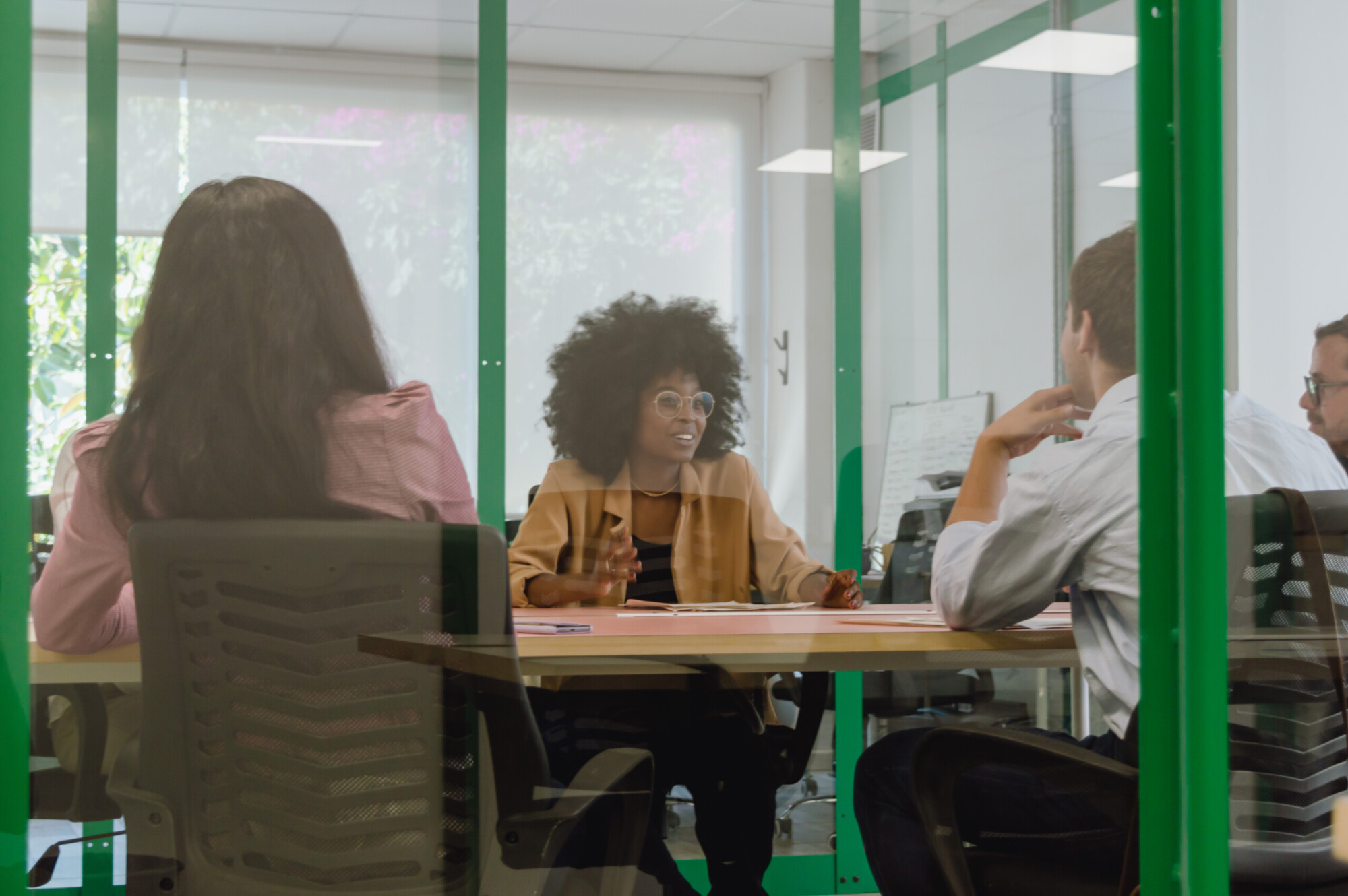 young latin afro business girl meeting inside an office