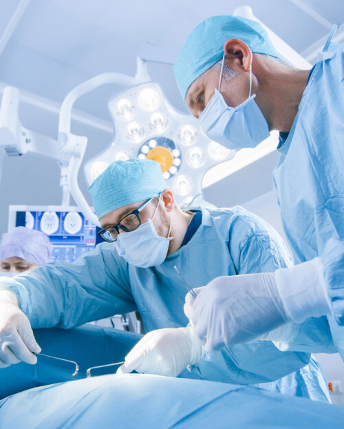 Low Angle Shot of a Diverse Team of Professional Surgeons Perfor