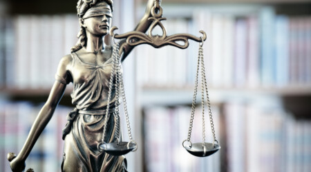 Legal and law statue of Lady Justice scales of justice and books