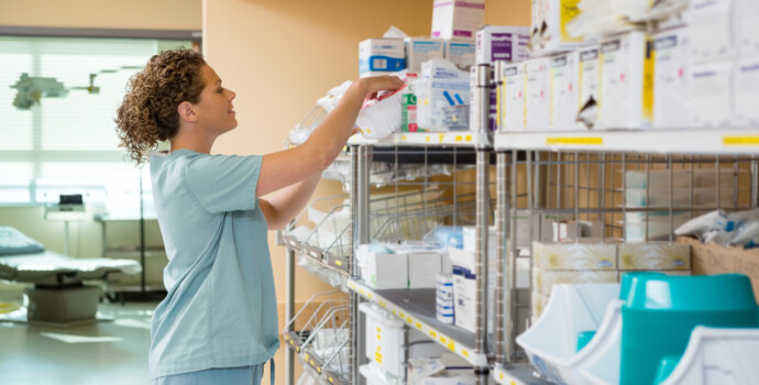 Female Nurse Working In Storage Room