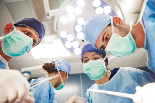 Low angle view of surgeons over the operating table