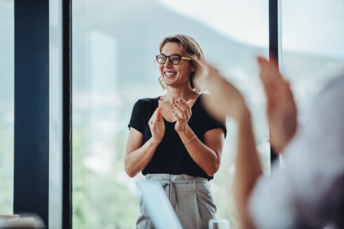 Business people women applauding after productive meeting