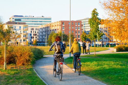 Girls on bicycles in public park in Vilnius