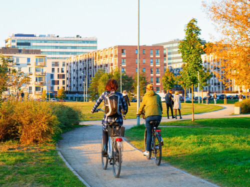 Girls on bicycles in public park in Vilnius