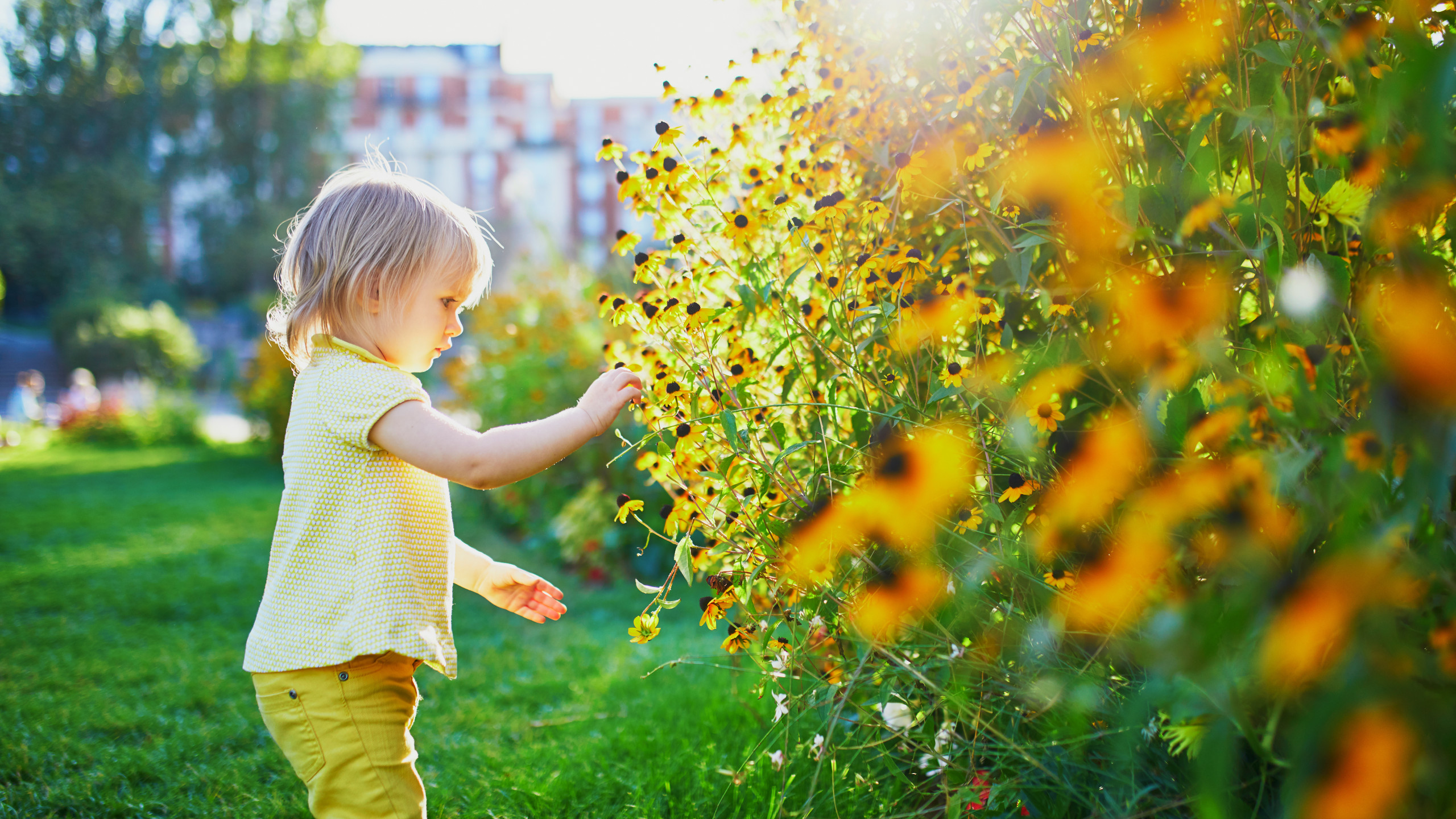 Adorable toddler girl having fun in park