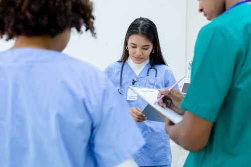 Medical woman student wear blue uniform study in hospital with g