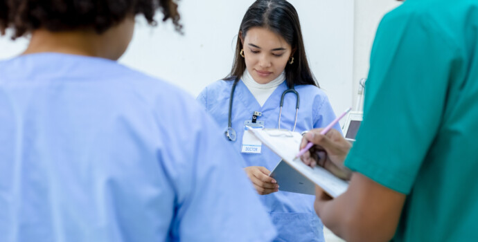 Medical woman student wear blue uniform study in hospital with g